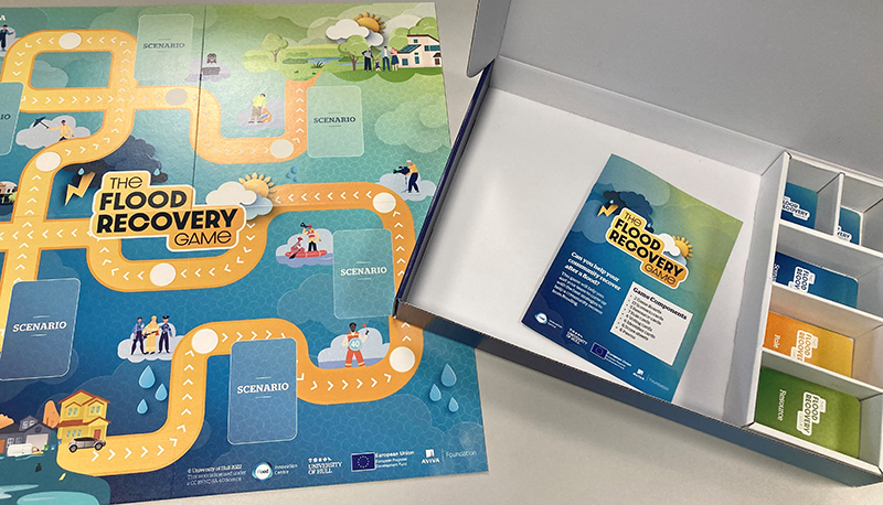 Image of the Flood Recovery Board game, instruction and playing cards that were developed for the project