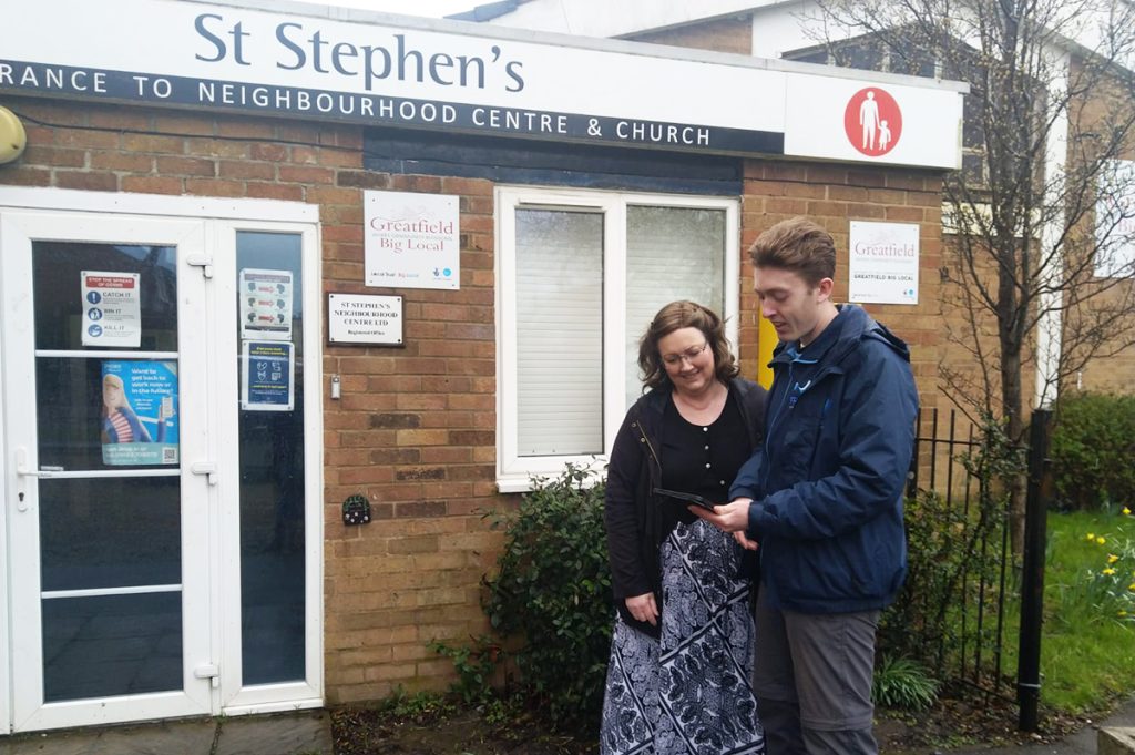 A representative of the St Stephen's Community Centre meets with a professional flood surveyer 