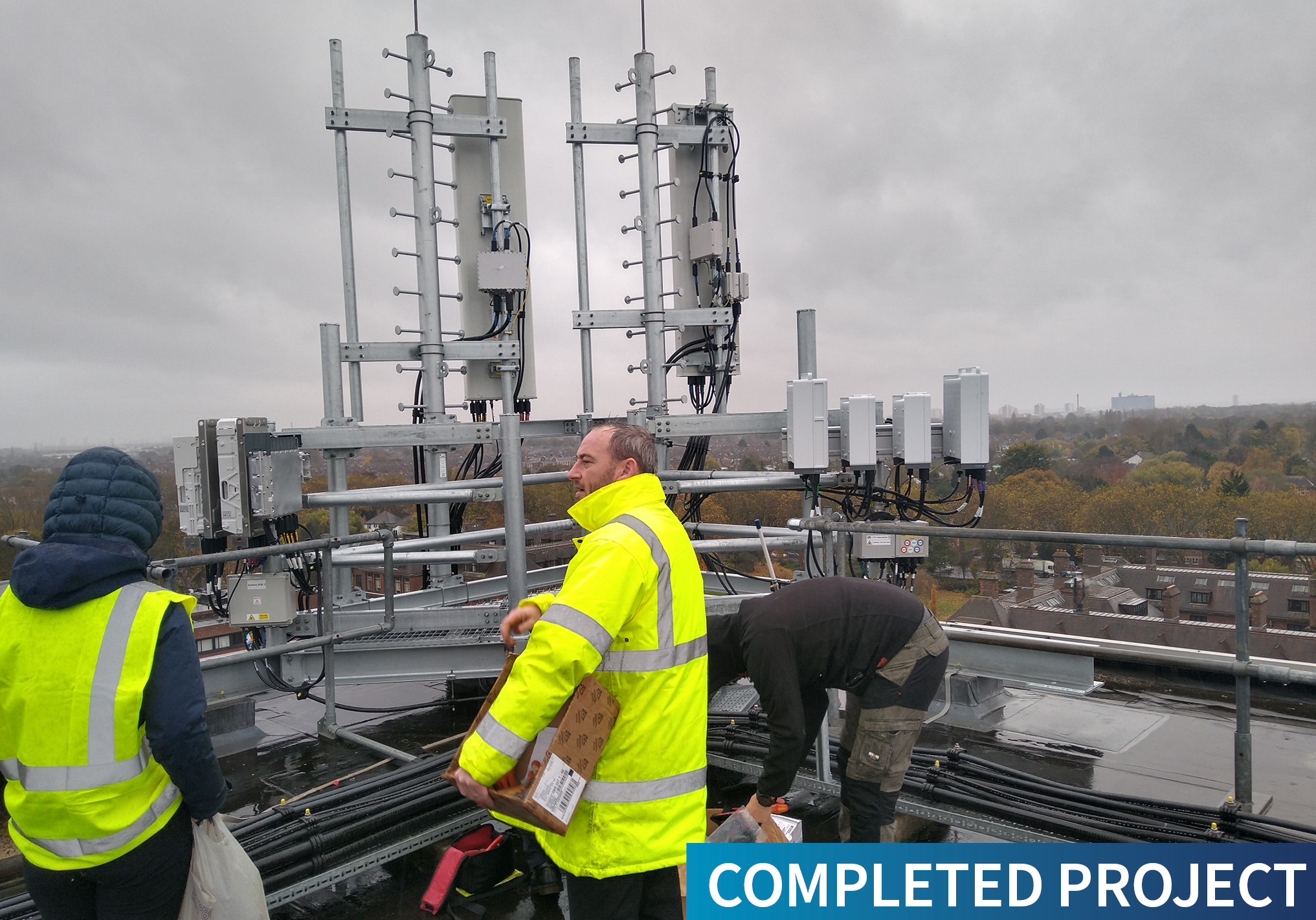 Andel team members install equipment on the roof of the University of Hull library